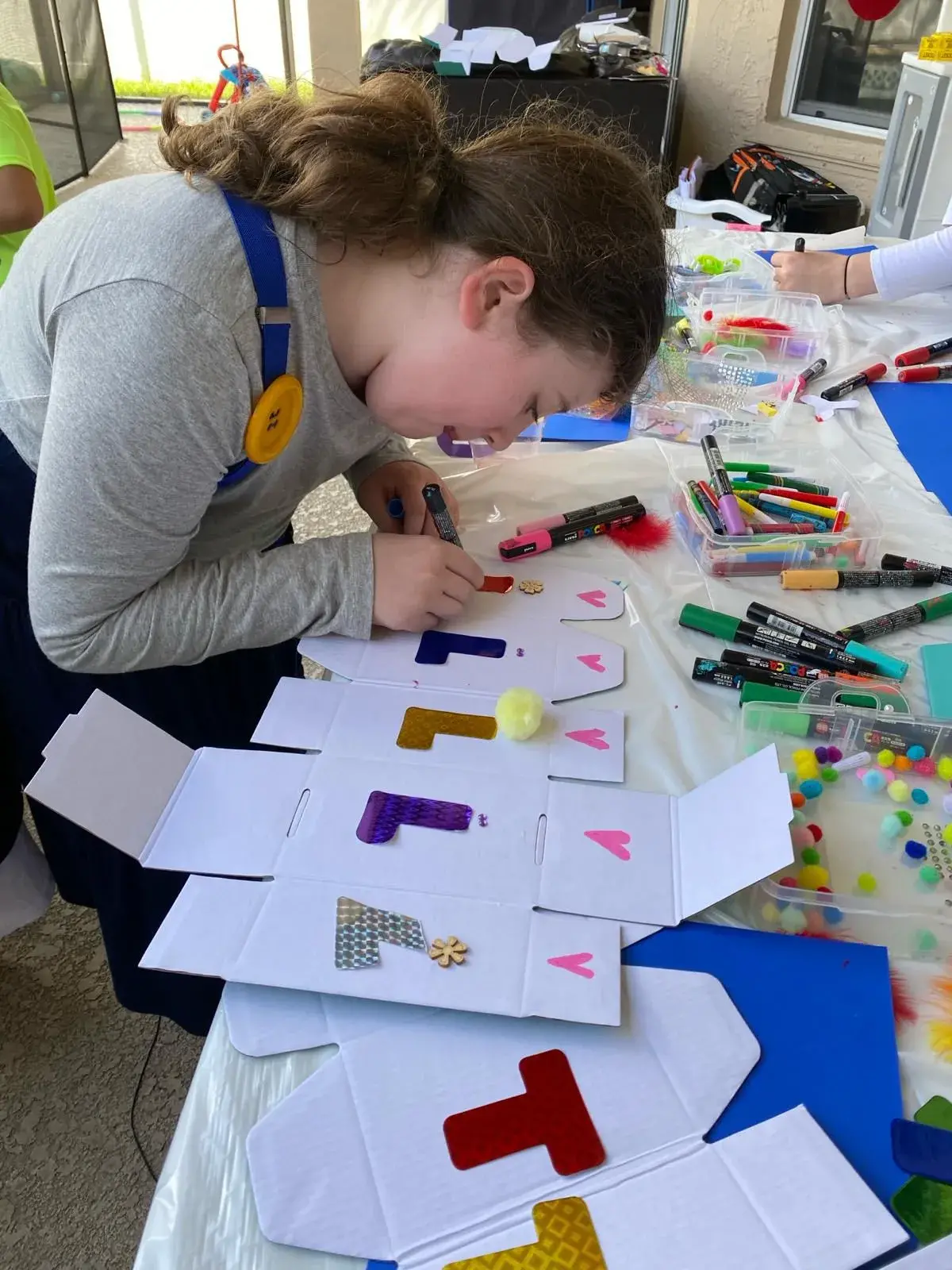 A girl is engaged in crafting